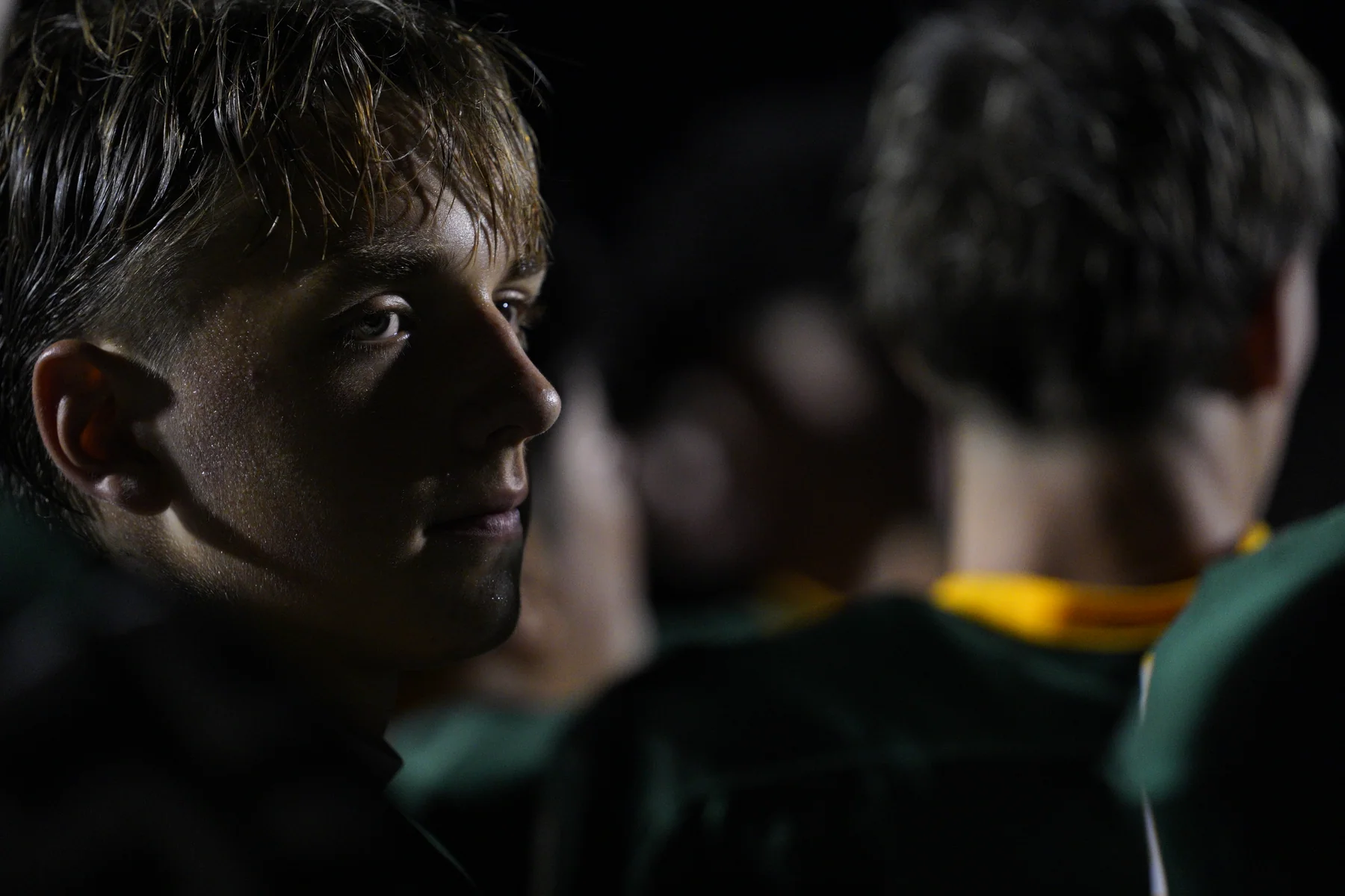 Football player in a quiet sideline portrait