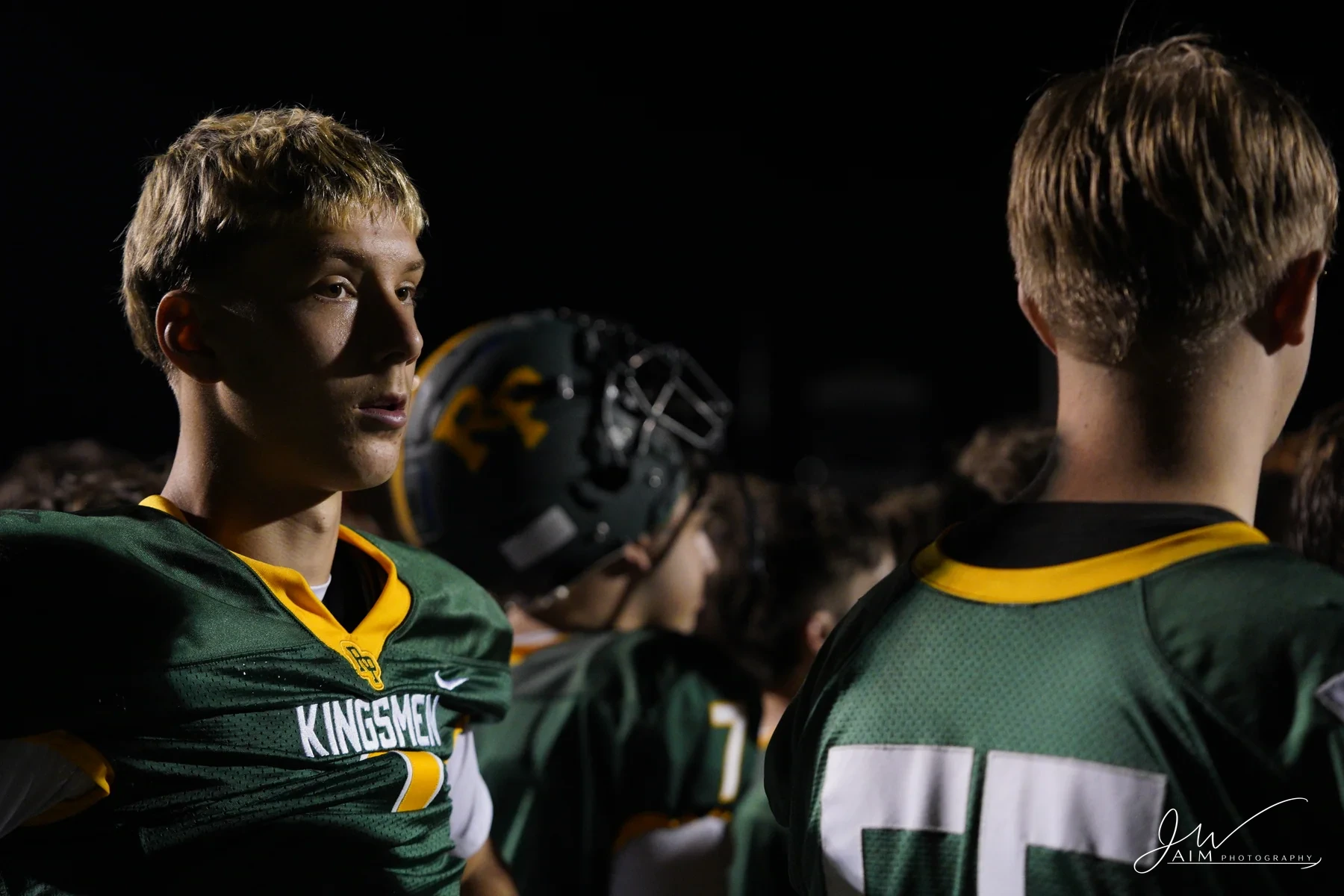 Football athlete during a game-night moment